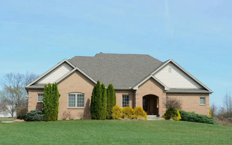 Brick house with a well-kept lawn (illustrative photo for Homes for sale in Waterloo)