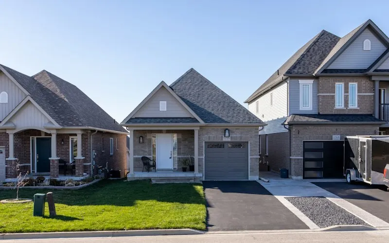 Detached houses with garages in a subdivision (illustrative photo for Detached houses across the region)