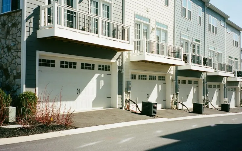 Row of modern townhouses with garages (illustrative photo for Townhouses for sale in Waterloo)